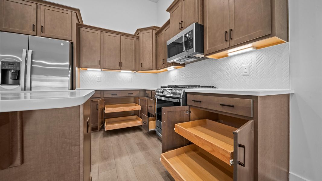 First-class finishes and a thoughtfully scaled island highlight this elegant kitchen space