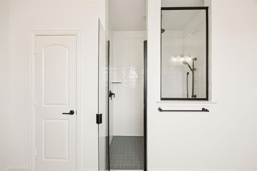 Large walk-in spa shower. *Model representation.