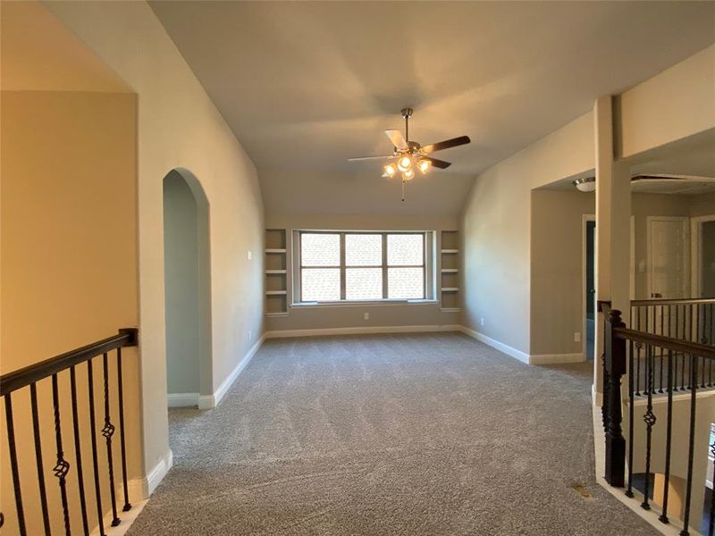 Large gamerroom with built-in shelves and ceiling fan is great for entertaining Large gamerroom with built-in shelves and ceiling fan is great for entertaining