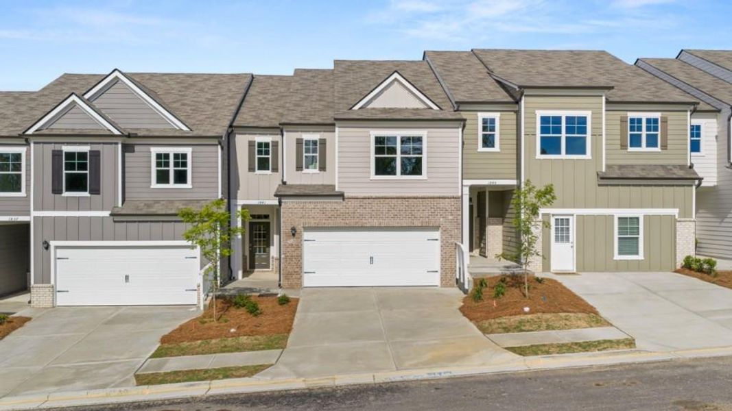 Front exterior of a new home in Village at Pine Valley, Gainesville, GA, highlighting curb appeal (Image 2). Front exterior of a new home in Village at Pine Valley, Gainesville, GA, highlighting curb appeal (Image 2).