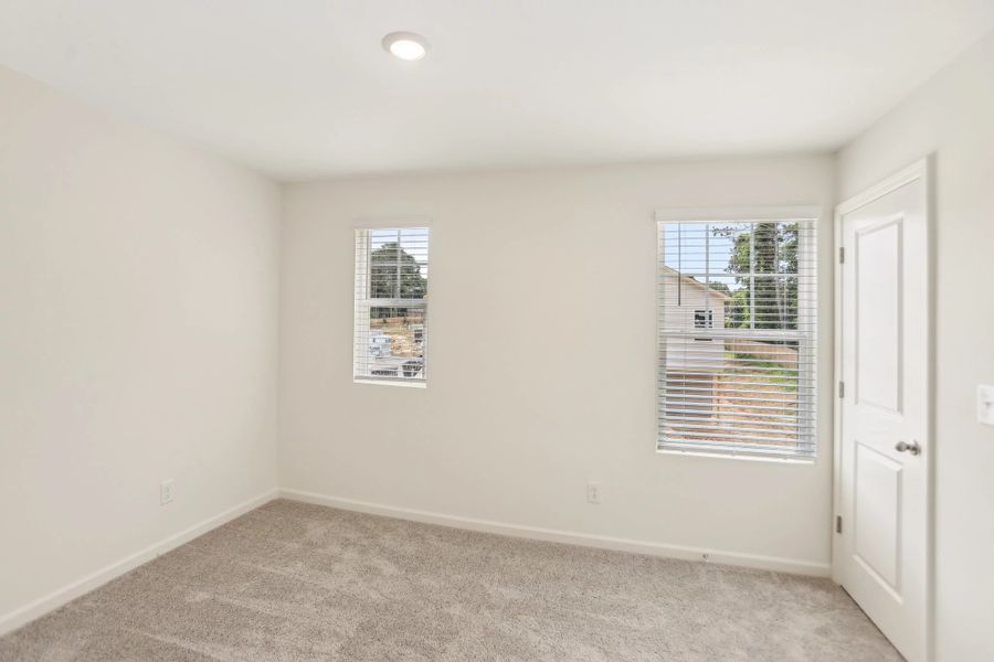 Representative unfurnished interior of a home built from the Triton by Starlight Homes in Kendall Grove, McDonough (Image 22).
