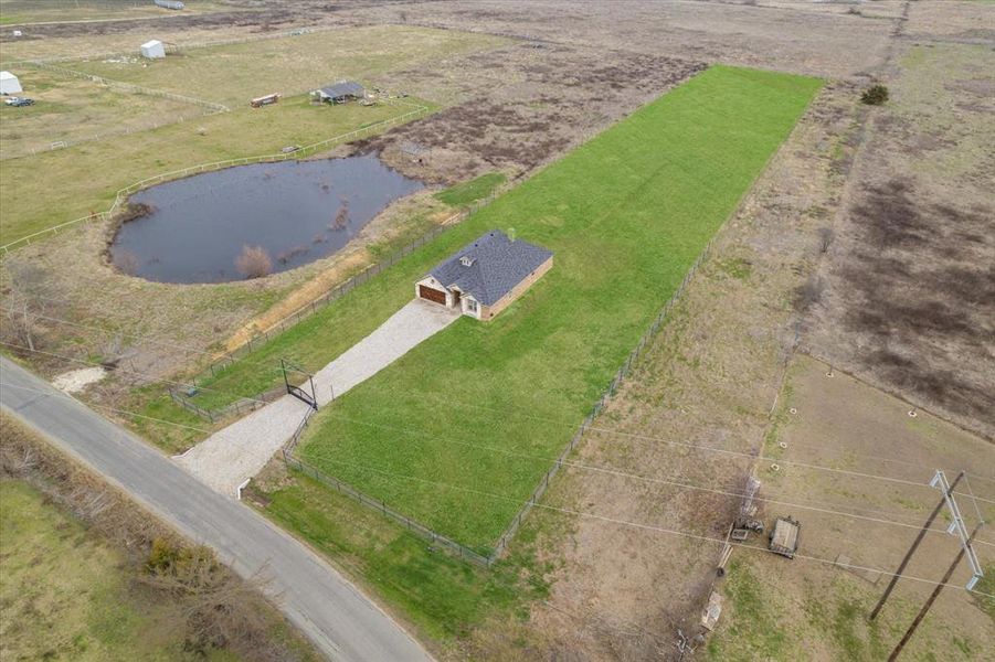 Drone / aerial view featuring a water view and a rural view