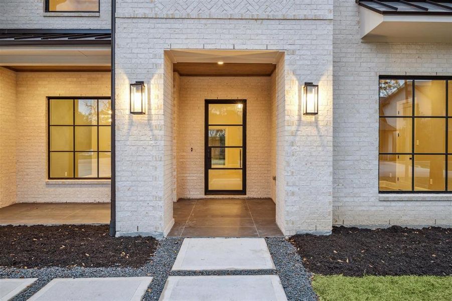 Stunning steel and glass front door makes a statement