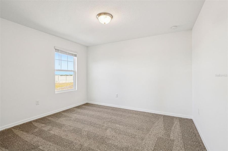 Spacious, unfurnished interior of a new home in Lake Deer Estates - Classic Series, Poinciana (Image 22).