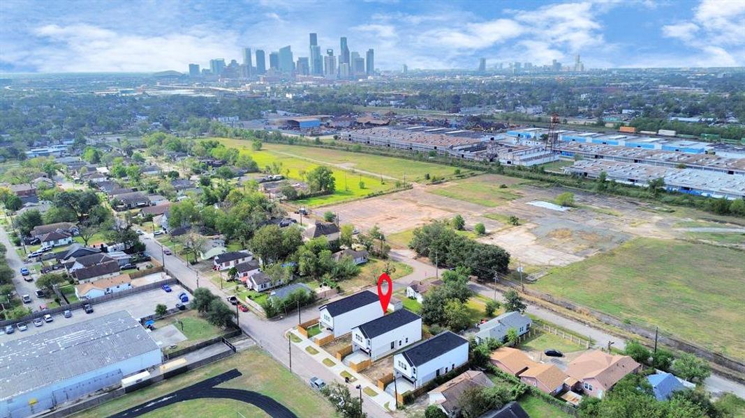 An aerial view of a spacious subdivision lot, highlighting a fully fenced perimeter, offering a lot of privacy.