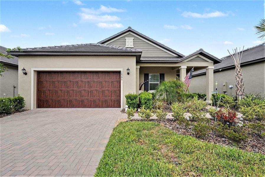 Front exterior of a new home in , Land O' Lakes, FL, highlighting curb appeal (Image 21).
