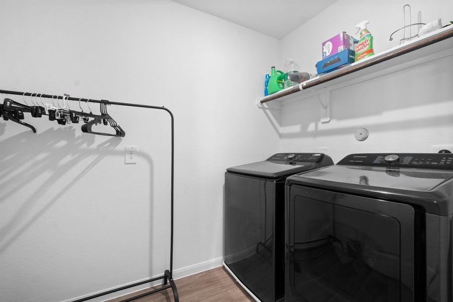 Laundry room is conveniently located upstairs.