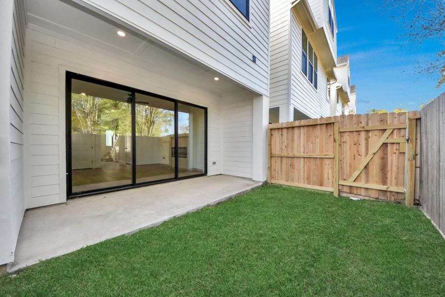 Exterior details and patio area of a home in Caywood Place, Houston (Image 27).