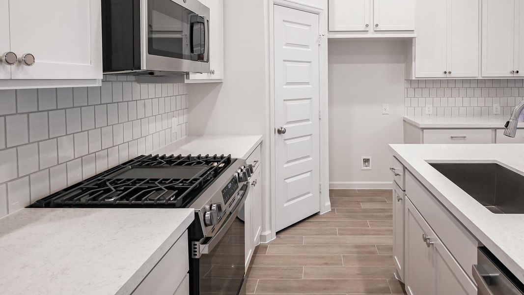 Furnished interior view inside a new home in Crosswinds 40', Kyle (Image 9).