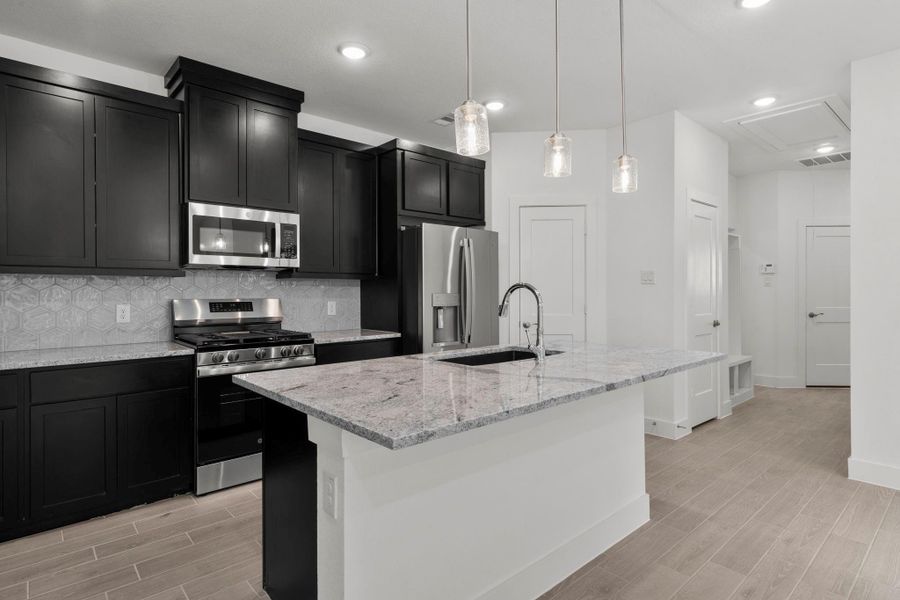 Furnished interior view inside a new home in Meridiana, Iowa Colony (Image 7).