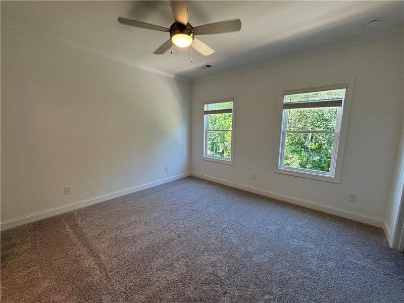 Primary bedroom has tons of light.