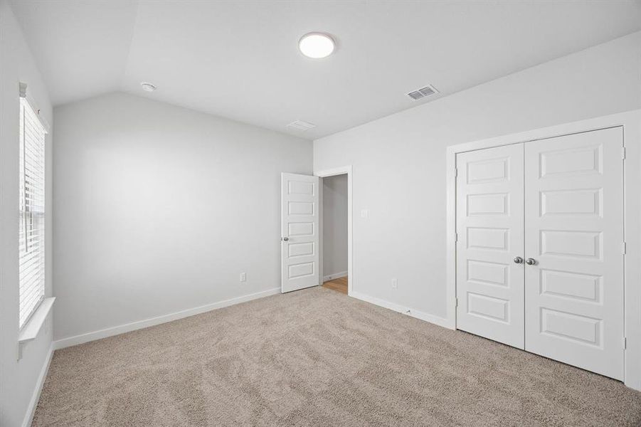 Primary Suite in the Oscar home plan by Trophy Signature Homes – REPRESENTATIVE PHOTO
