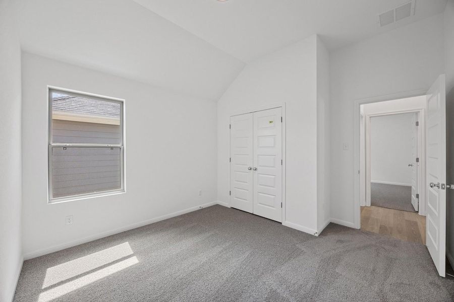 Bedroom in the Cypress home plan by Trophy Signature Homes – REPRESENTATIVE PHOTO