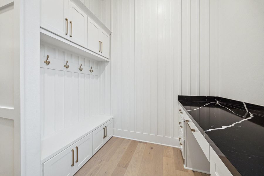 From the oversize garage, enter into the home through the mud room area, the perfect place to store backpacks and shoes From the oversize garage, enter into the home through the mud room area, the perfect place to store backpacks and shoes