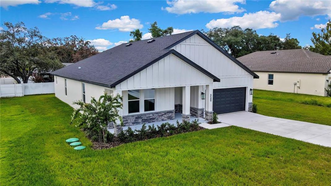 Front exterior of a new home in , Spring Hill, FL, highlighting curb appeal (Image 22). Front exterior of a new home in , Spring Hill, FL, highlighting curb appeal (Image 22).