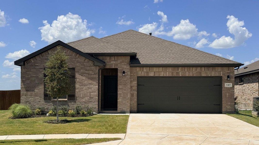 Front exterior of a new home in Bluestem, Rhome, TX, highlighting curb appeal (Image 1). Front exterior of a new home in Bluestem, Rhome, TX, highlighting curb appeal (Image 1).