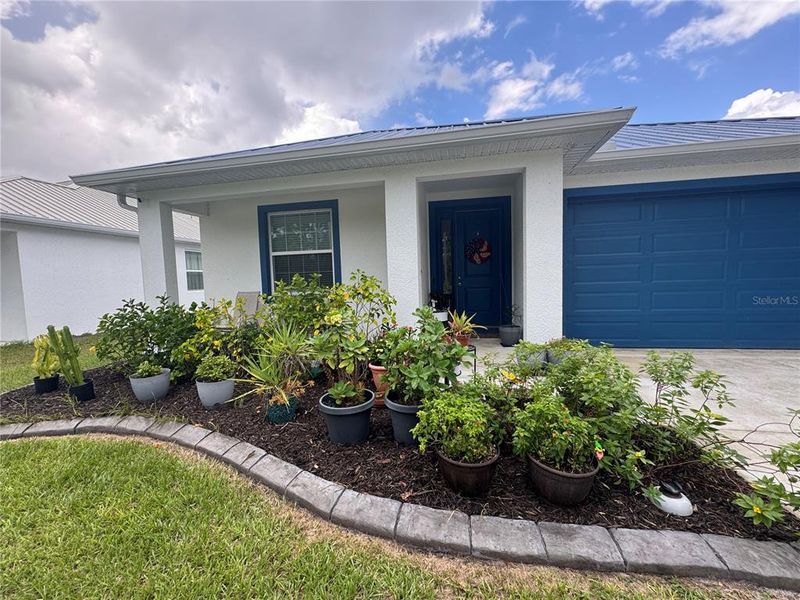 Front exterior of a new home in , Osteen, FL, highlighting curb appeal (Image 2).