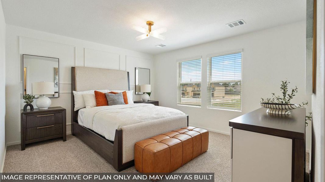 A well-lit bedroom features plush carpeting and broad windows. A well-lit bedroom features plush carpeting and broad windows.