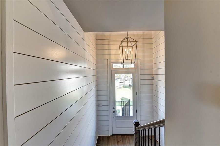 Entryway with an inviting chandelier and wood-type flooring  ***Photos NOT OF ACTUAL Home but for representation Purposes only. Home is UNDER Construction- Photos are of a previously built Model House Freemont plan by The Providence Group