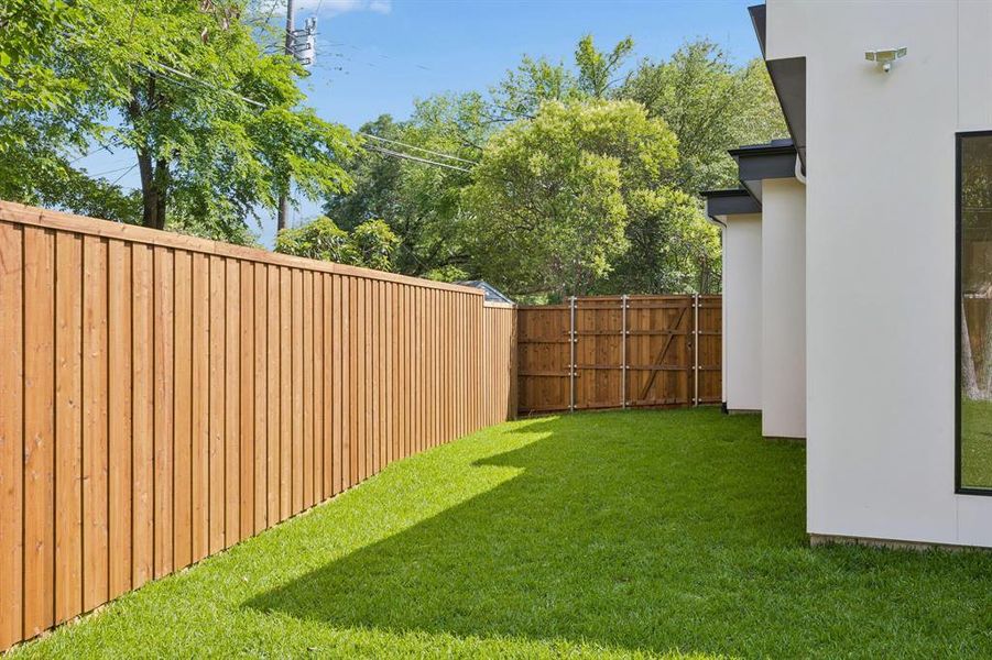 Large side yard with gate to the front yard.