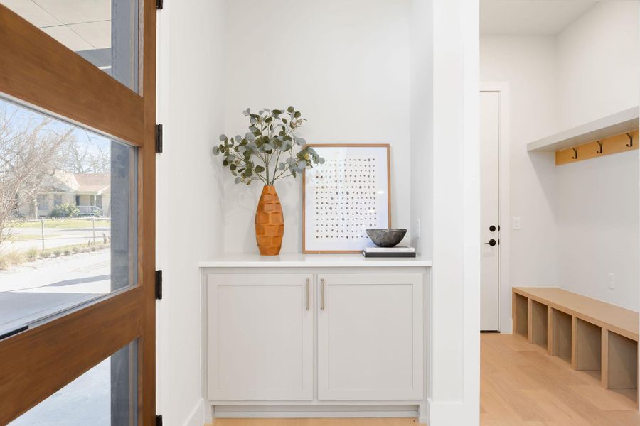 Mudroom with light wood finished floors