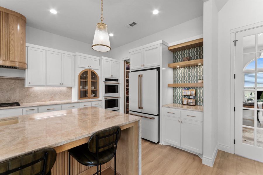 Kitchen is a showstopper with custom BUTLERS PANTRY and coffee bar. Kitchen is a showstopper with custom BUTLERS PANTRY and coffee bar.