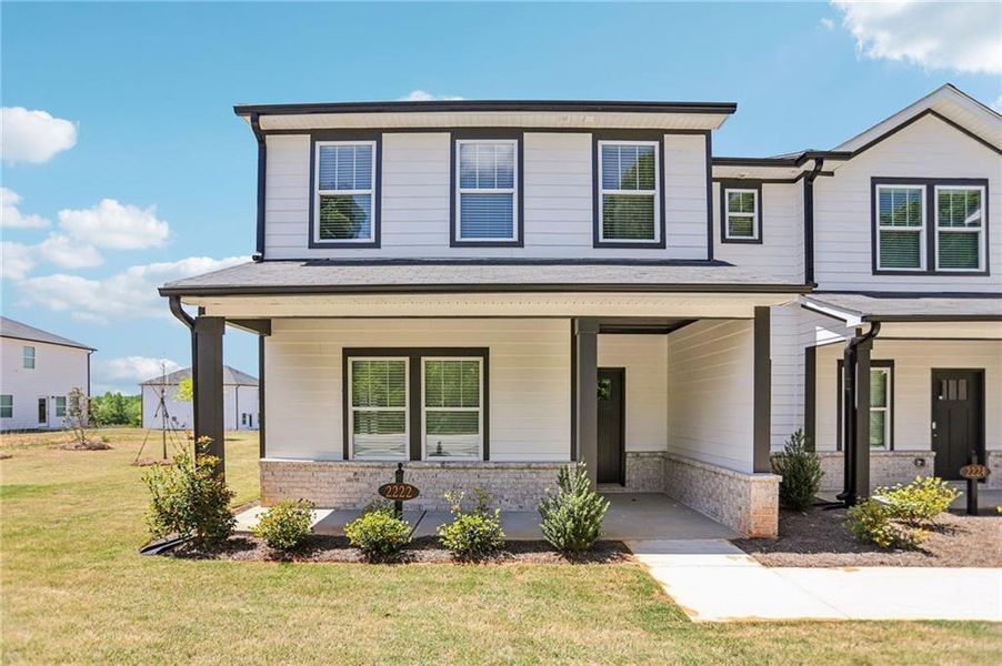 Front exterior of a new home in Avalon - Vista Series, Conyers, GA, highlighting curb appeal (Image 27).