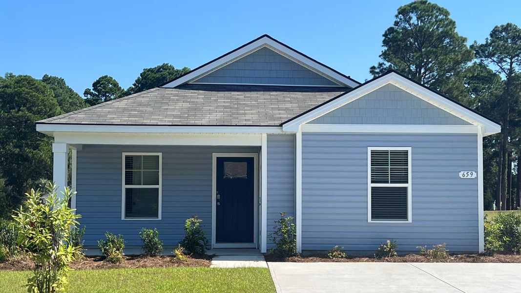 Front exterior of a new home in Sandpiper Place, Myrtle Beach, SC, highlighting curb appeal (Image 1).