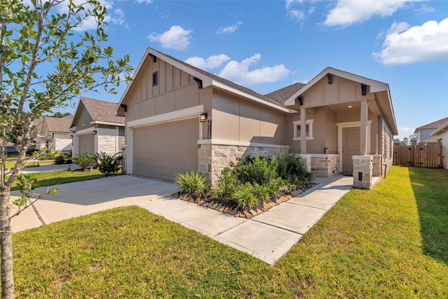 Front exterior of a new home in , Magnolia, TX, highlighting curb appeal (Image 25). Front exterior of a new home in , Magnolia, TX, highlighting curb appeal (Image 25).