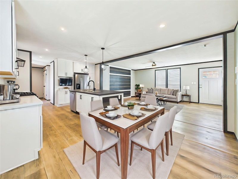 (Virtually Staged) Kitchen & Dining Area – Open kitchen with large center island, pendant lighting, and ample room for dining or entertaining.