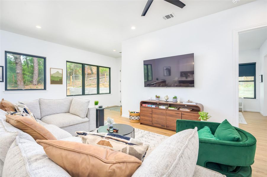 Living room looks out to the pine trees in the backyard!