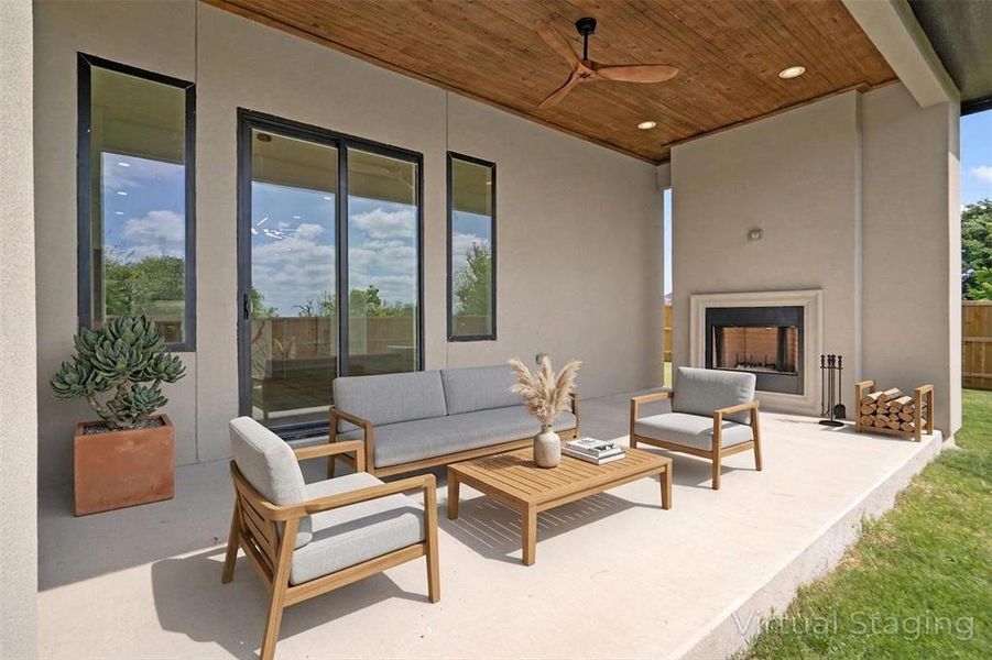The property features a covered patio with a wooden plank ceiling and a ceiling fan, providing comfort and style The property features a covered patio with a wooden plank ceiling and a ceiling fan, providing comfort and style