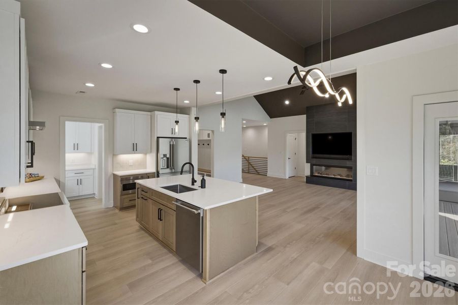 Here is a little different view from the corner of the dining room into the family room. Here is a little different view from the corner of the dining room into the family room.