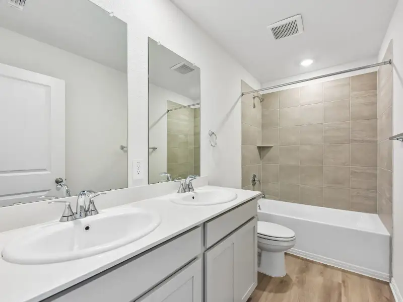 Furnished interior view inside a new home in Lexington Parke, Del Valle (Image 6).