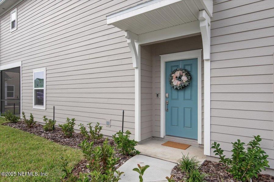 Exterior details and patio area of a home in Hardwick Farms: Hardwick Farms - Townhome Collection, Jacksonville (Image 29).
