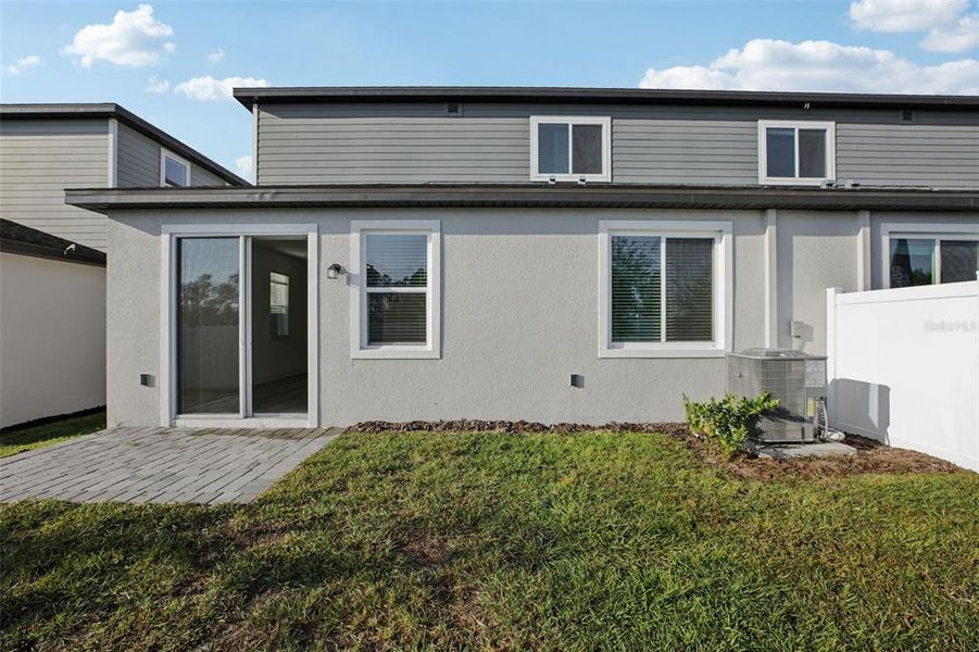 Exterior details and patio area of a home in Cyrene at Minneola - Villas, Minneola (Image 24).