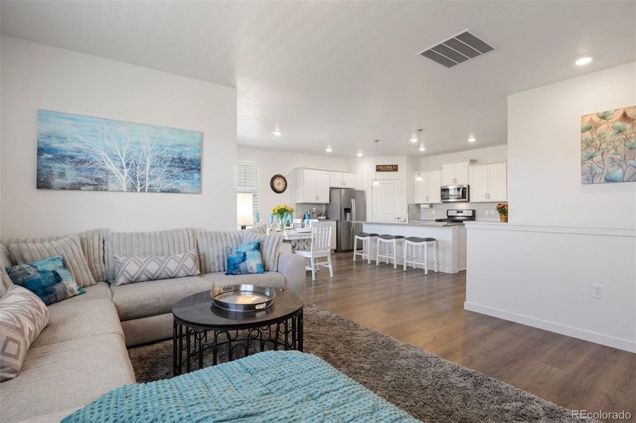 Seamless flow between living, dining, and kitchen areas ideal for entertaining.