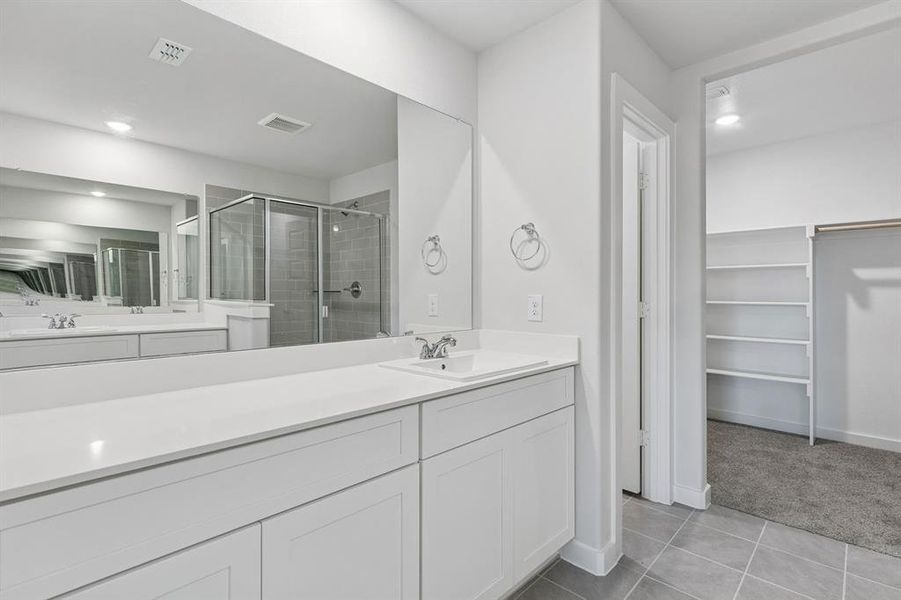 Primary Bathroom in the Harrison home plan by Trophy Signature Homes – REPRESENTATIVE PHOTO