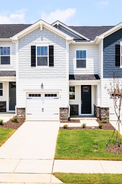 Front exterior of a new home in Vaughan Farms, Angier, NC, highlighting curb appeal (Image 19). Front exterior of a new home in Vaughan Farms, Angier, NC, highlighting curb appeal (Image 19).