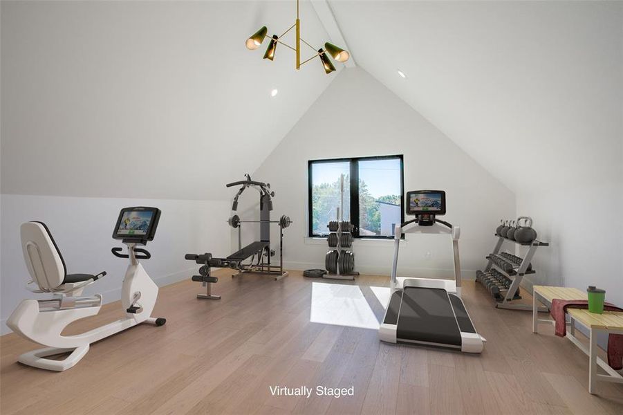 Versatile bonus room with vaulted ceilings, ideal for a home gym, media room, or additional living space.