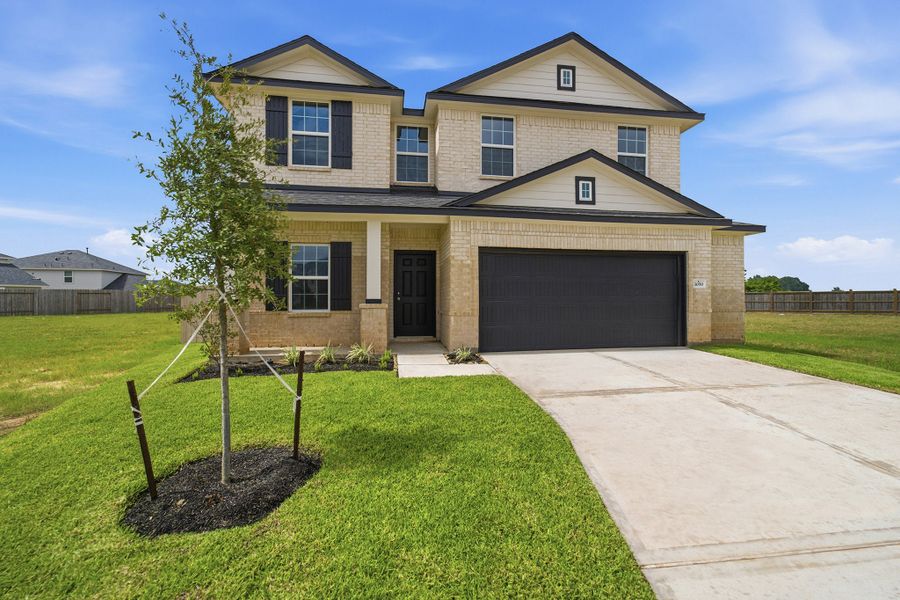 Front exterior of a new home in Bluestem, Brookshire, TX, highlighting curb appeal (Image 26).