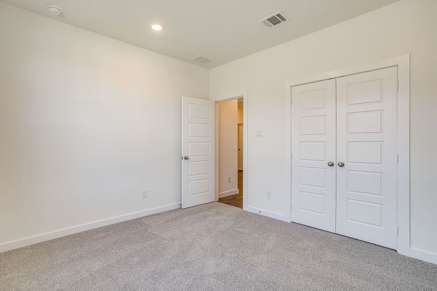 Representative unfurnished interior of a home built from the Palmer by Graham Hart Home Builder in Bear Ridge, Burleson (Image 27).