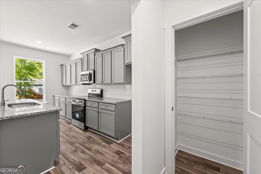 Furnished interior view inside a new home in Ellington Farms, Statham (Image 9).