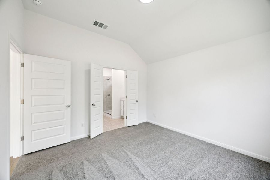 Primary Suite in the Spruce home plan by Trophy Signature Homes - REPRESENTATIVE PHOTO