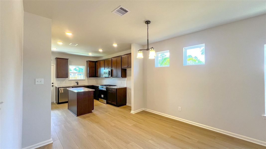 The Blue Jay II- Family Room into Dining and Kitchen