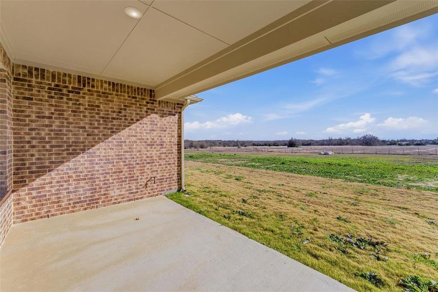 View of patio with a rural view