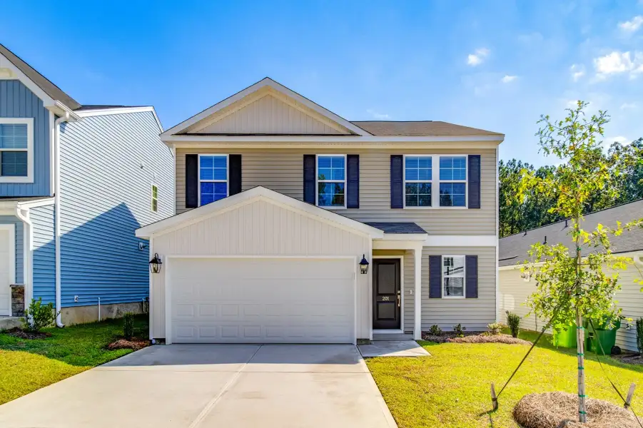 Front exterior of a new home in Killians Crossing, Blythewood, SC, highlighting curb appeal (Image 1). Front exterior of a new home in Killians Crossing, Blythewood, SC, highlighting curb appeal (Image 1).
