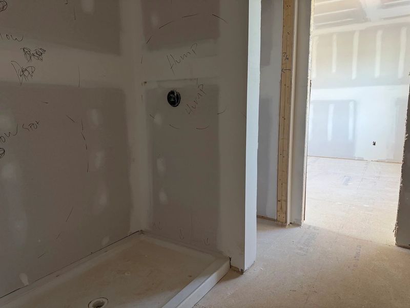 Primary Bath featuring the AW Collection® Coastal - Spa-like with white cabinets and light tile.