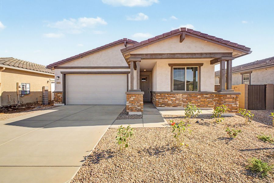 Front exterior of a new home in Empire Pointe, Queen Creek, AZ, highlighting curb appeal (Image 1). Front exterior of a new home in Empire Pointe, Queen Creek, AZ, highlighting curb appeal (Image 1).