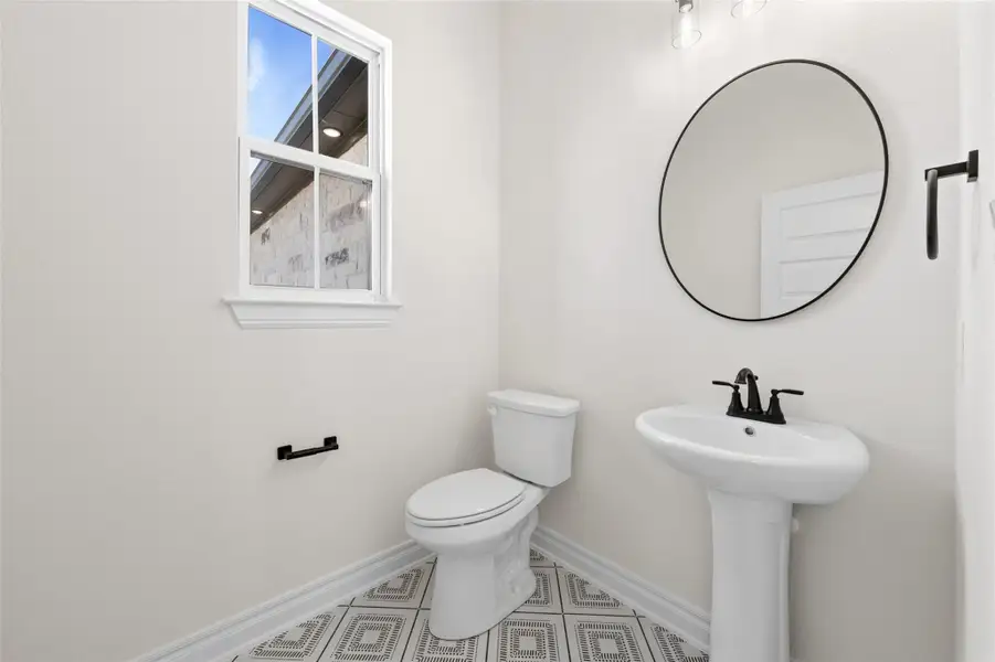 Bathroom with baseboards and toilet Bathroom with baseboards and toilet